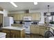 Bright kitchen featuring an island, white appliances, and tiled backsplash at 880 W Moon Shadow Dr, Casa Grande, AZ 85122