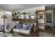 Cozy sunroom featuring tile floors, comfortable seating, and unique decor at 880 W Moon Shadow Dr, Casa Grande, AZ 85122