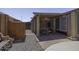 Relaxing covered patio with brick pavers and adjacent gravel area at 880 W Moon Shadow Dr, Casa Grande, AZ 85122
