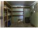 Ample storage room equipped with built in shelving and concrete floor for organized home storage at 880 W Moon Shadow Dr, Casa Grande, AZ 85122