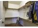 Spacious walk-in closet featuring shelving on all sides for storing clothing, shoes, and accessories at 880 W Moon Shadow Dr, Casa Grande, AZ 85122