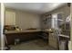 Functional workshop with ample counter space, storage cabinets, and pegboard for organizing tools and supplies at 880 W Moon Shadow Dr, Casa Grande, AZ 85122