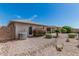 Desert landscaped backyard with bushes, air conditioning unit, and covered patio in view at 11529 E Lindner Ave, Mesa, AZ 85209