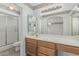 Bathroom vanity with sink, mirror, shower and toilet at 11529 E Lindner Ave, Mesa, AZ 85209