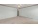 Bedroom featuring neutral walls, carpet flooring and a door to the bathroom at 11529 E Lindner Ave, Mesa, AZ 85209
