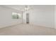 Bright bedroom with a large window, ceiling fan, and convenient access to a walk-in closet at 11529 E Lindner Ave, Mesa, AZ 85209