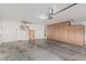 Large garage with built-in cabinets, providing ample storage and functionality for vehicles and projects at 11529 E Lindner Ave, Mesa, AZ 85209
