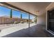 Relaxing covered patio with a well-manicured desert-landscaped backyard and privacy wall at 11529 E Lindner Ave, Mesa, AZ 85209