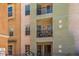 Exterior view of a balcony with furniture on a multi-story home under a clear sky at 14575 W Mountain View Blvd # 11212, Surprise, AZ 85374