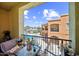 Balcony view showcasing the community pool, outdoor seating, and well-maintained landscaping at 14575 W Mountain View Blvd # 11212, Surprise, AZ 85374