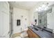 Bathroom featuring dual sinks, marble shower, and stylish decor at 14575 W Mountain View Blvd # 11212, Surprise, AZ 85374