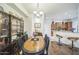 Formal dining area adjacent to the kitchen featuring an oval table and wooden chairs at 14575 W Mountain View Blvd # 11212, Surprise, AZ 85374
