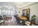 Open-concept living area, dining room with wood floors and a living room with comfortable seating at 14575 W Mountain View Blvd # 11212, Surprise, AZ 85374