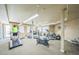 Bright gym with modern equipment including treadmills, stationary bikes, and elliptical machines at 14575 W Mountain View Blvd # 11212, Surprise, AZ 85374
