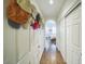 Hallway with a view into the bedroom with a beautiful wooden floor and white walls at 14575 W Mountain View Blvd # 11212, Surprise, AZ 85374