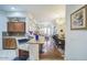 Gourmet kitchen featuring granite countertops, stainless steel appliances, and a spacious dining area at 14575 W Mountain View Blvd # 11212, Surprise, AZ 85374