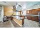 Spacious kitchen featuring large island, stainless steel appliances, and custom cabinetry at 14575 W Mountain View Blvd # 11212, Surprise, AZ 85374