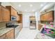 Well-equipped kitchen with stainless steel appliances, granite countertops, and ample cabinet space at 14575 W Mountain View Blvd # 11212, Surprise, AZ 85374