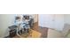 Spacious home office with modern desk setup, chair, and wood flooring at 14575 W Mountain View Blvd # 11212, Surprise, AZ 85374