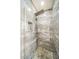 Modern walk-in shower with gorgeous marble tile walls, pebble flooring and multi-jet shower system at 14575 W Mountain View Blvd # 11212, Surprise, AZ 85374
