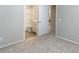 En suite bathroom with a shower-tub combo and a door leading to the laundry area at 14870 W Encanto Blvd # 1106, Goodyear, AZ 85395