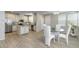 Open floor plan kitchen and dining area with stainless steel appliances and ample cabinet space at 14870 W Encanto Blvd # 1106, Goodyear, AZ 85395