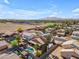 Beautiful aerial view showing neighborhood homes with sparkling pools and well maintained yards at 16040 W Grant St, Goodyear, AZ 85338