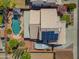 A bird's eye view shows solar panels, a pool and boat parked behind the home at 16040 W Grant St, Goodyear, AZ 85338