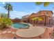 Private backyard featuring a sparkling pool, shaded gazebo, and a spacious patio area at 16040 W Grant St, Goodyear, AZ 85338