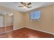 Bedroom showcasing a window, closet, and wood-look flooring, creating a comfortable atmosphere at 16040 W Grant St, Goodyear, AZ 85338
