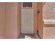 Exterior view of front door with security screen, doorbell, and outside light at 16040 W Grant St, Goodyear, AZ 85338