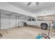 Spacious three-car garage with ample space for storage and a full-size pickup truck at 16040 W Grant St, Goodyear, AZ 85338