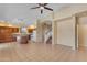 Bright and airy living room with an open layout, seamlessly connecting the kitchen and living spaces for easy entertaining at 16040 W Grant St, Goodyear, AZ 85338