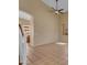 Open-concept living room with tile floors, neutral walls, and bright, natural light at 16040 W Grant St, Goodyear, AZ 85338