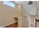 Open loft area featuring a built-in desk and hardwood floors, perfect for a home office or study space at 16040 W Grant St, Goodyear, AZ 85338