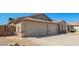 Well maintained driveway to attached 2 car garage, desert landscaping and tile roof in this property at 16817 W Bradford Way, Surprise, AZ 85374