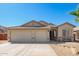 Inviting single-story home with a well-maintained desert-style yard and a convenient two-car garage at 16817 W Bradford Way, Surprise, AZ 85374
