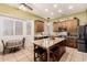 Bright kitchen featuring wood cabinets, stainless steel appliances, and a granite-topped island at 16817 W Bradford Way, Surprise, AZ 85374