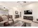 Spacious living room featuring modern decor, comfortable seating, and ample natural light at 16817 W Bradford Way, Surprise, AZ 85374