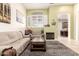 Inviting living area with neutral tones, a fireplace, and an abundance of natural light at 16817 W Bradford Way, Surprise, AZ 85374