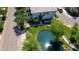 Aerial view of home with a charming courtyard and pond surrounded by lush greenery at 1814 E Bridgeport Pkwy # 103, Gilbert, AZ 85295