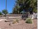 Elegant stone entrance sign for The Lakes at Annecy, nestled amongst mature trees and landscaping at 1814 E Bridgeport Pkwy # 103, Gilbert, AZ 85295