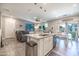 Bright kitchen with island seating, stainless appliances, and open layout to the living area at 1814 E Bridgeport Pkwy # 103, Gilbert, AZ 85295