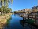 Scenic view of a well maintained pond with walking paths in a friendly community at 1814 E Bridgeport Pkwy # 103, Gilbert, AZ 85295