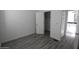 Bright bedroom with vinyl floors and closet access to ensuite bathroom at 1820 N Thornton Rd # 917, Casa Grande, AZ 85122