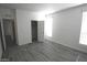 Large bedroom with vinyl floors and bright, natural light at 1820 N Thornton Rd # 917, Casa Grande, AZ 85122