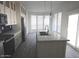 Bright kitchen with a large island, stainless steel appliances, and plenty of natural light at 1820 N Thornton Rd # 917, Casa Grande, AZ 85122
