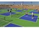 Aerial view of community pickleball courts filled with active players at 1820 N Thornton Rd # 917, Casa Grande, AZ 85122