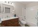 Bathroom with sleek vanity, modern fixtures, and combined shower and tub at 19443 N 36Th St, Phoenix, AZ 85050