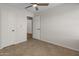 Bright bedroom showcasing tile flooring and an ensuite bathroom providing privacy at 19443 N 36Th St, Phoenix, AZ 85050
